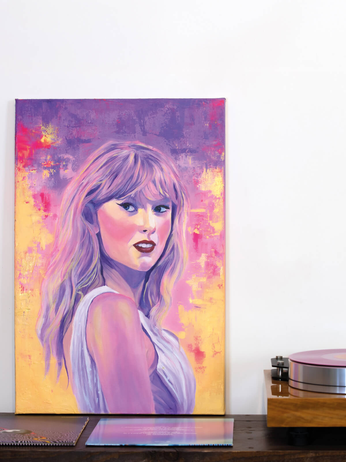 Original Taylor Swift portrait painting alongside vinyl by Nat Morgan